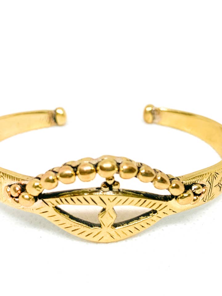 Eyes of the Desert Bangle Yellow Brass for wholesale by SHE ARCHIVES