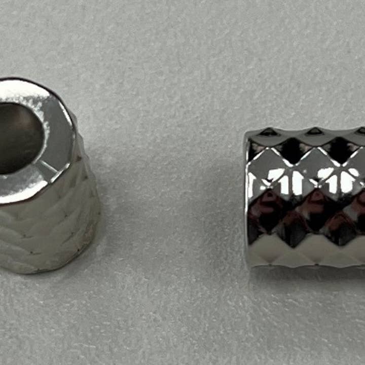 SILVER COLOR CORD TERMINAL for wholesale by NEMARK