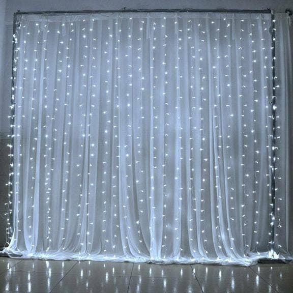 300 LED Curtain Lights w/Remote Plug In - White for wholesale on Faire
