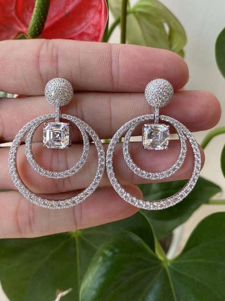 Orecchini a doppia orbita alare per la vendita all'ingrosso da parte di By lilly Paris