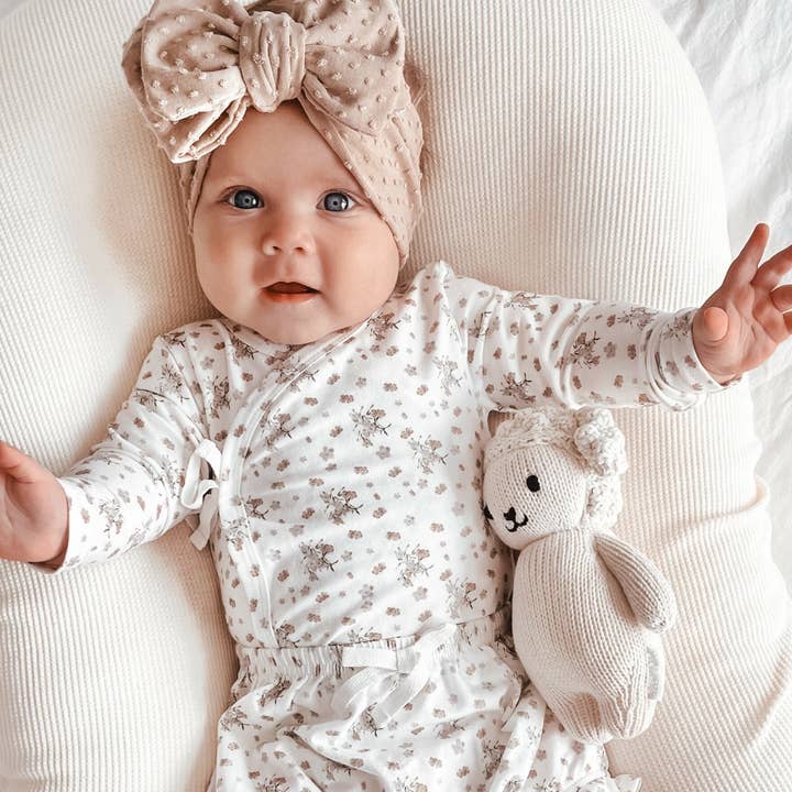 Bamboo/Organic Cotton Kali Bodysuit - Vanilla Bouquet and other Purchase Wholesale kalyani. Free Returns & Net 60 Terms on Faire trending on Faire.