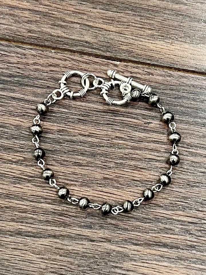 711516, Handmade Polish Navajo Bead Adjustable Bracelet for wholesale by ISAC Trading Inc