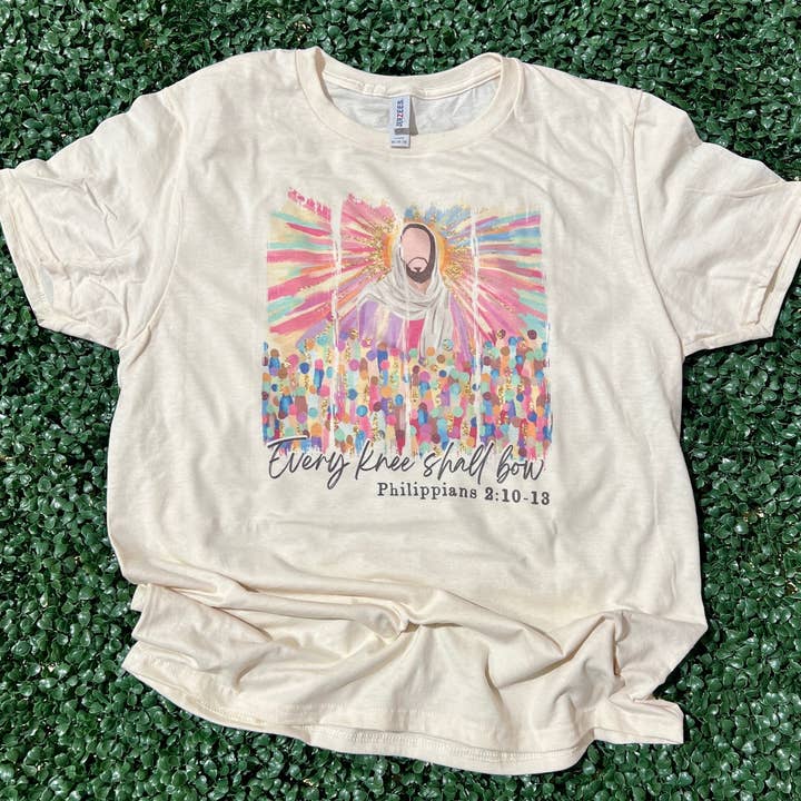 Every Knee Shall Bow Watercolor on Cream Tee for wholesale by RMN Wholesale