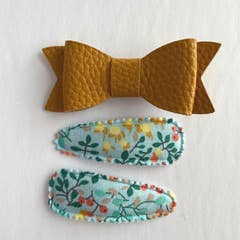 Faux leather bow and cotton hair clips for wholesale by Lox Lion
