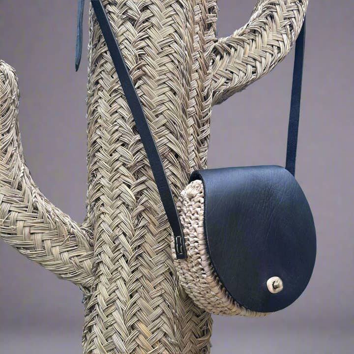 Handwoven Palm Leaves & Leather wicker Saddle Bag for wholesale by Artisan Stories