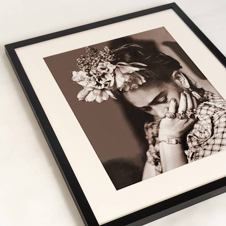 Black Frida Kahlo image. Wall art print with frame. for wholesale on Faire