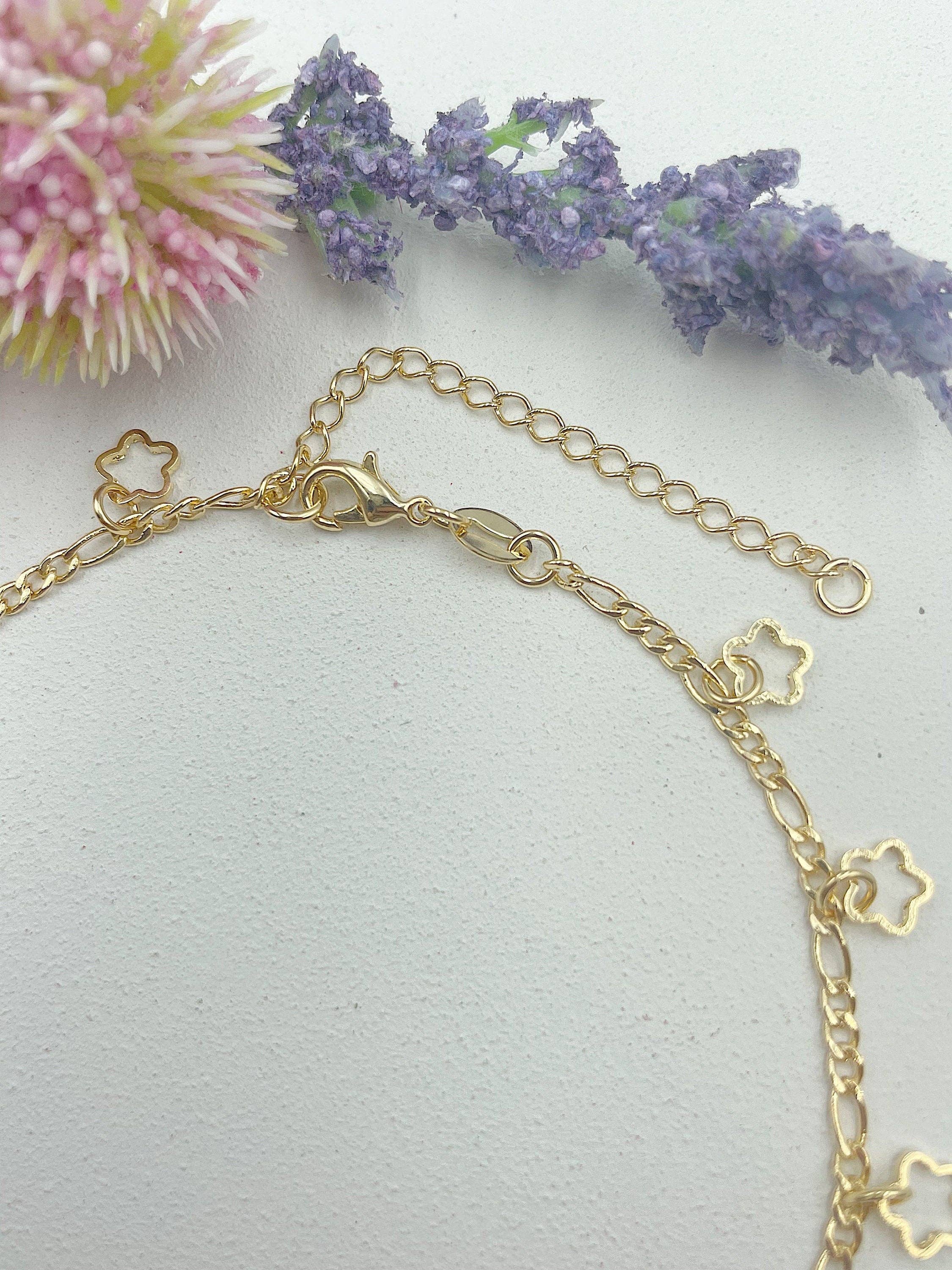 Cherie by Cherie - Wholesale Anklet - 12 Open Stars Hanging From The Figaro Chain Anklet1