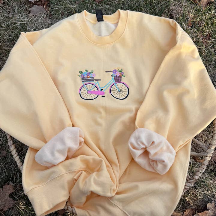 Preppy floral summer bicycle embroidered crewneck. for wholesale by Basil & Burch