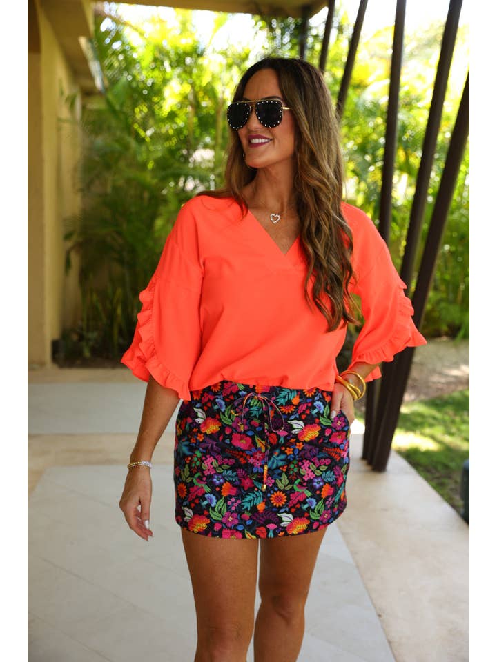 Amy Ruffle Sleeve Top, Neon Coral for wholesale on Faire