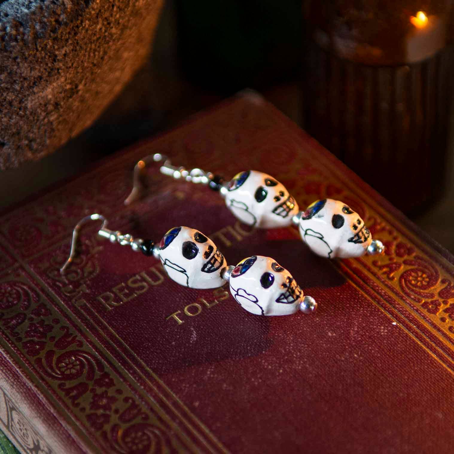 White Double Skull Earrings for wholesale on Faire0