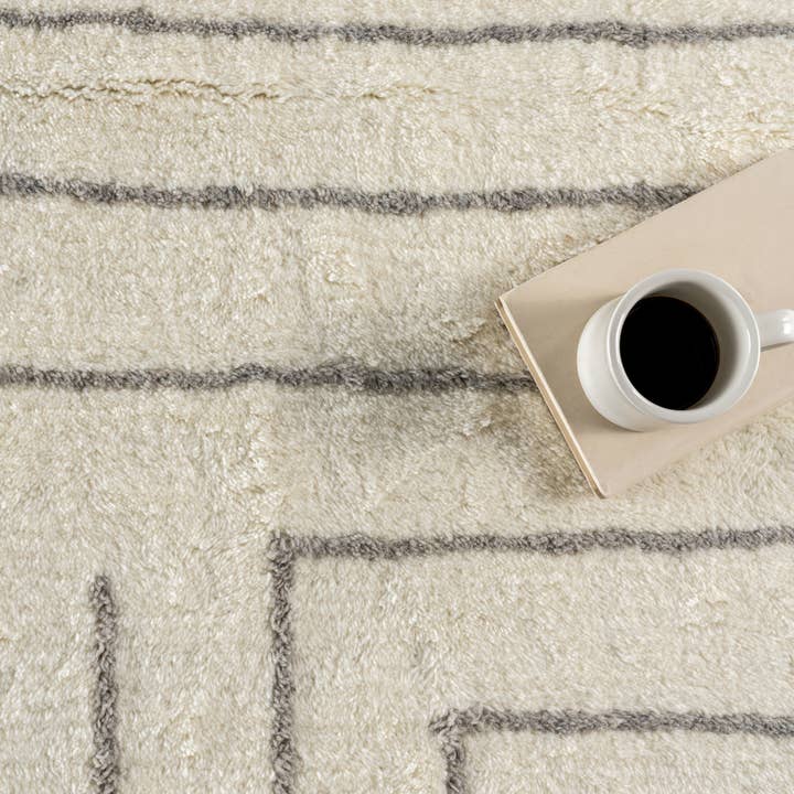 Ivory Frenshe Interiors x Rugs USA Outpost Graphic Area Rug for wholesale on Faire