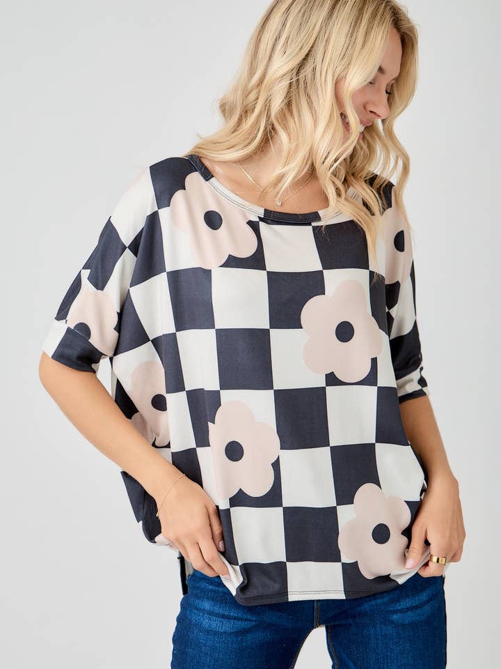 WOMEN'S PLUS SIZE CHECKERED FLORAL TOP WITH HIGH-LOW HEM
for wholesale by Celeste Clothing
