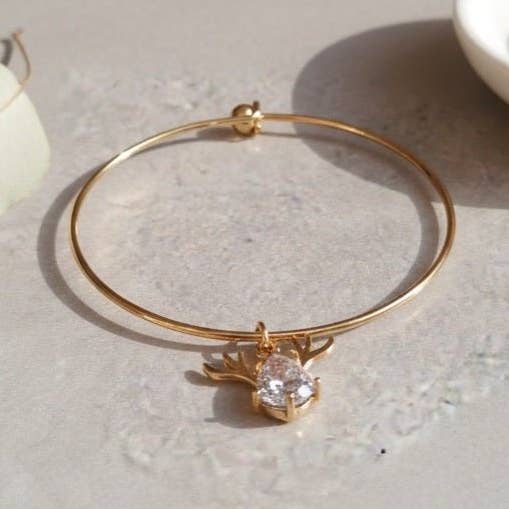 Reindeer - bracciale rigido dorato con ciondolo in cristallo per la vendita all'ingrosso da parte di OE!