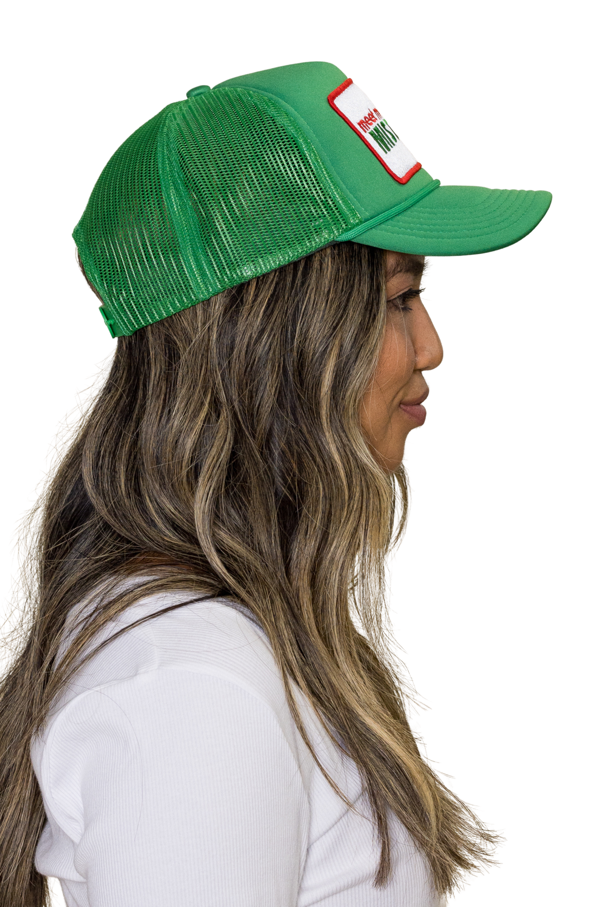 Meet Me Under The Mistletoe Trucker Hat in Green for wholesale on Faire2