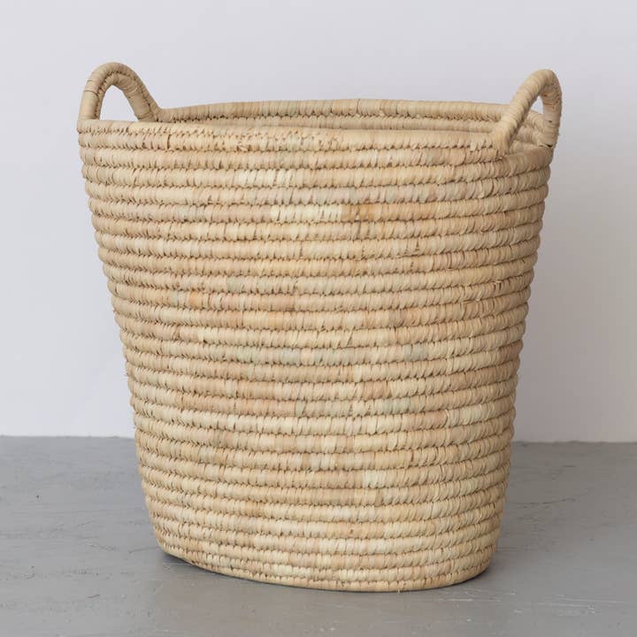 Oval Laundry Basket, palm leaf for wholesale by Will & Atlas