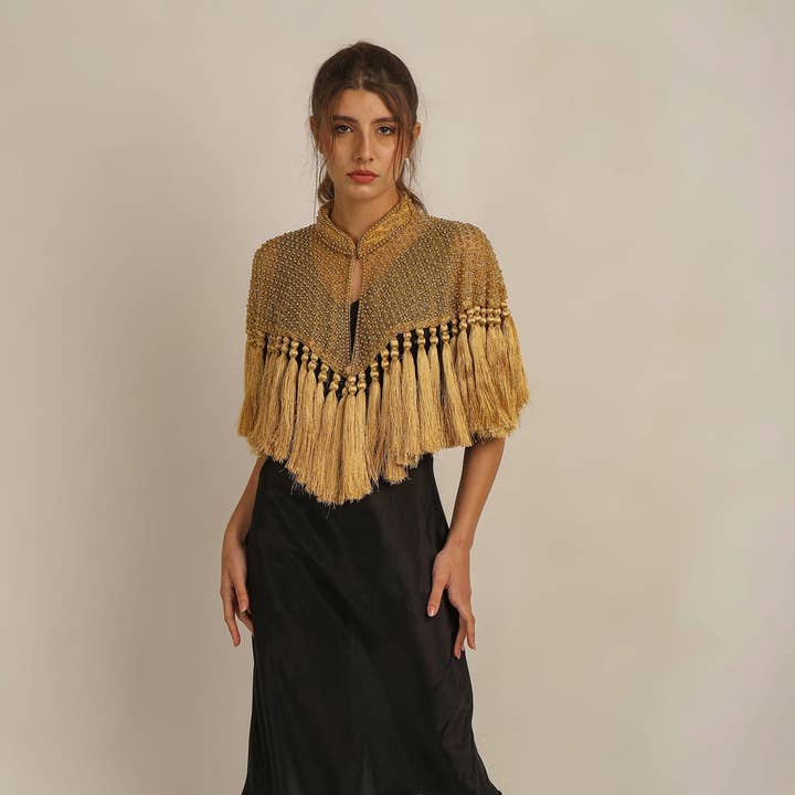 ZAZA BEADED/TASSEL CAPE - GOLD and other Purchase Wholesale zam zam. Free Returns & Net 60 Terms on Faire trending on Faire.
