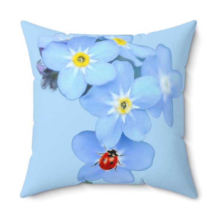 Ladybug on Forget me not Faux Suede Square Pillow for wholesale by Once Upon a Find Couture