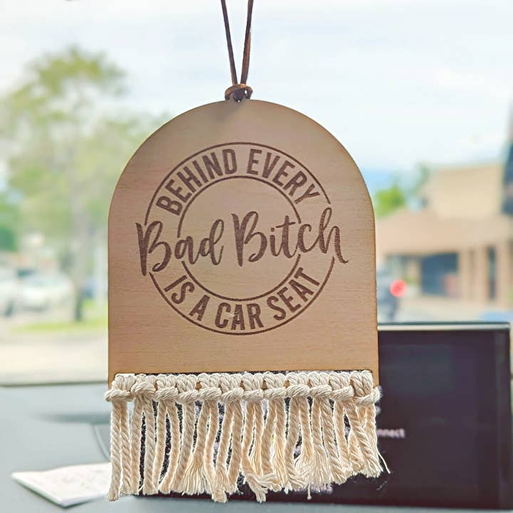 Off White Cord Behind Every Bad Bitch Is A Car Seat Car Charm for wholesale on Faire