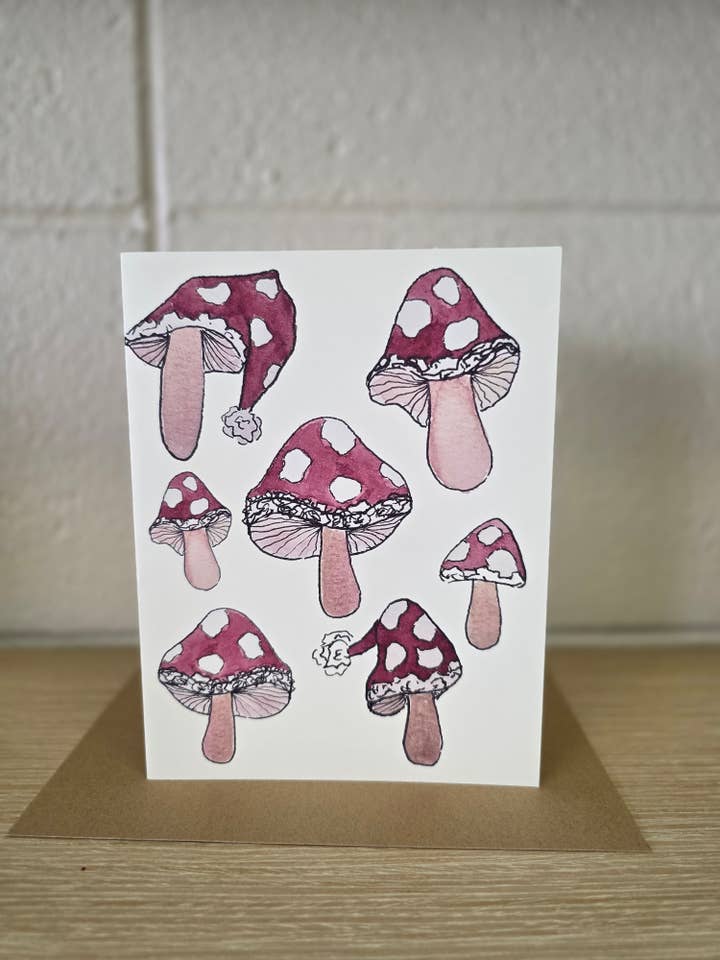 Santa Hat Mushrooms Greeting Card for wholesale by Covered With Art