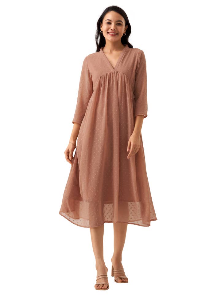 Robe à col en V à pois suisses Brasso en mousseline orange rouille pour la vente par STYLE INSTANT