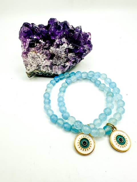 Quartz bleu (facetté) avec breloque en forme d'œil de protection en émail pour la vente par B.Birdwatcher Spiritual Stones