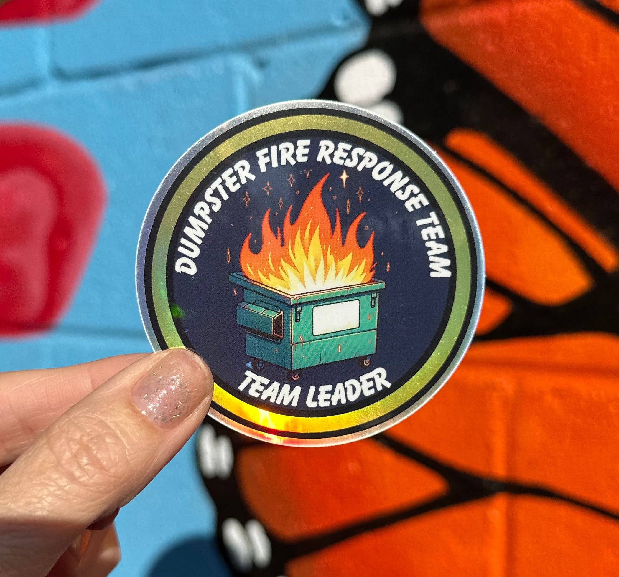 Hilarious Humanitarian - Wholesale Sticker - Dumpster Fire Response Team Team Leader Holographic Sticker