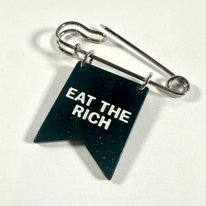 Eat the Rich Banner Ribbon Safety Pin for wholesale by Foolish Fetish