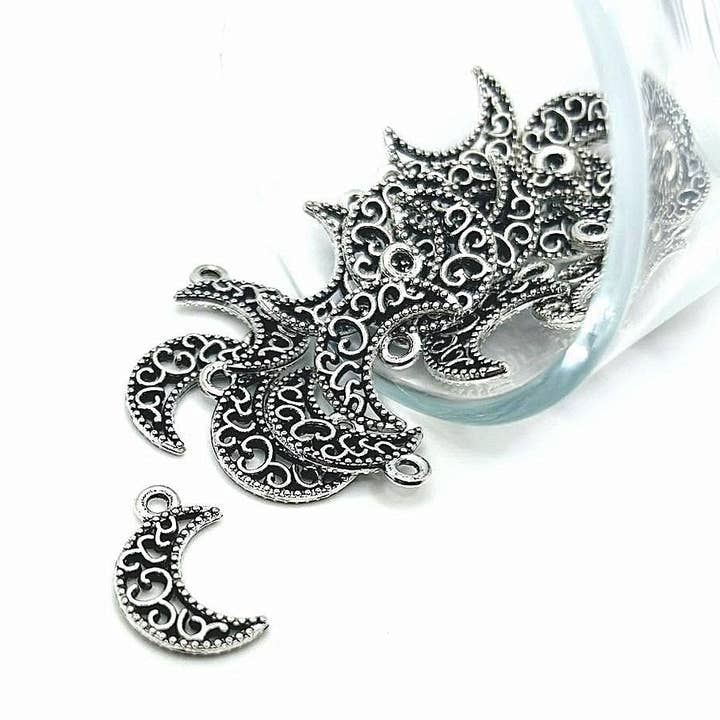 Silver Filigree Crescent Moon Charms, 18x11mm for wholesale by Guerrilla Charm