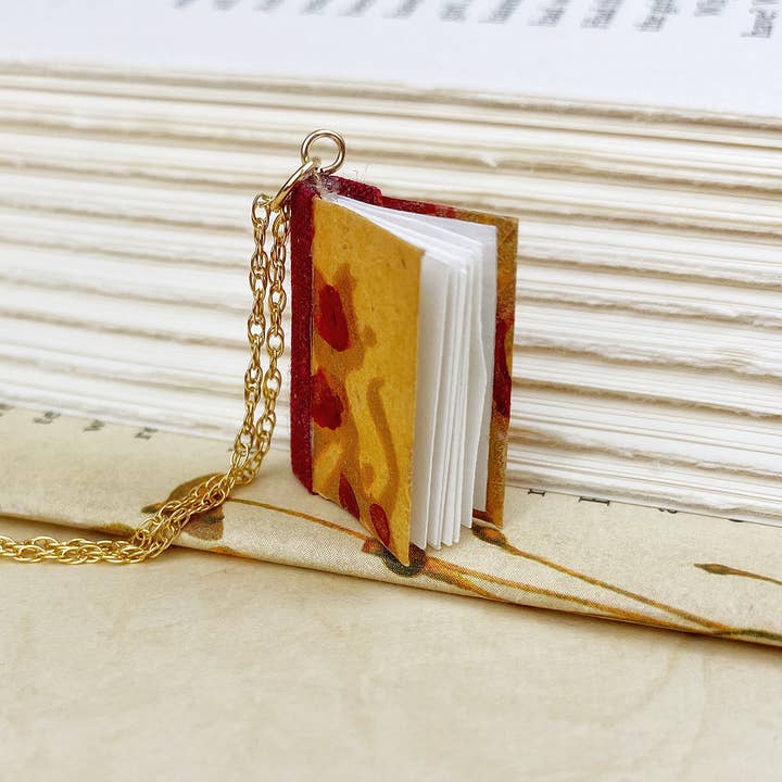 Golden Orange Parade Book Pendant for wholesale by Nicolette Tallmadge Designs