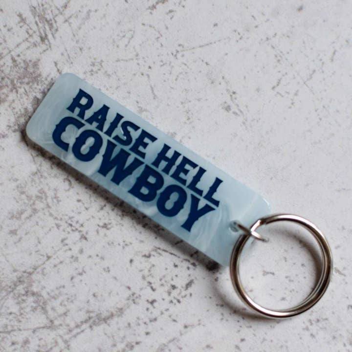 Raise Hell Cowboy Keychain for wholesale by Rock And Rose Motel