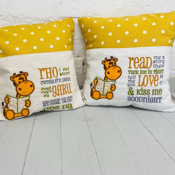 Cute Giraffe Children’s reading Book Cushion available in Welsh or English for wholesale by Lizzie Dixon Designs