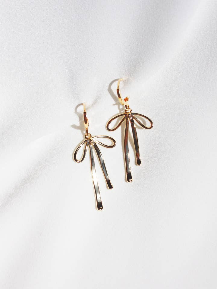 Gold Bow Huggie Hoop Earrings with Drapey Charms for wholesale by Zebber Handmade