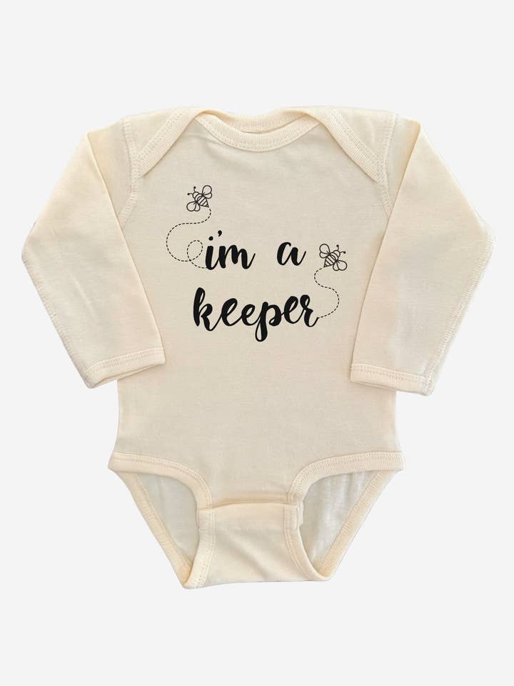 CREAM I'm a Keeper (Bee Keeper) Long Sleeve Baby Onesie Bodysuit for wholesale on Faire2