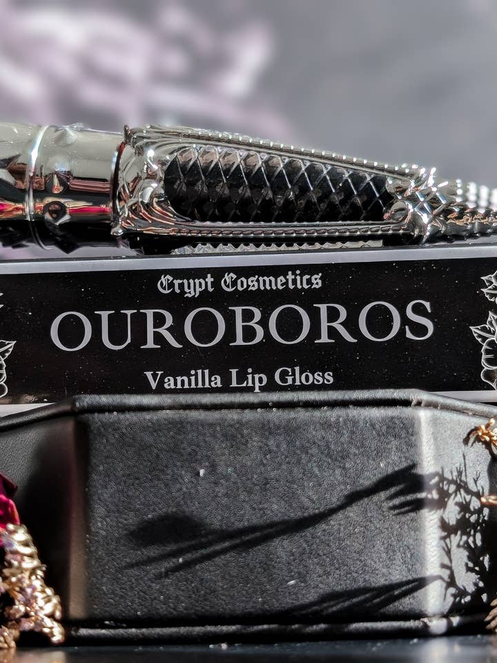 OUROBOROS (Silver Edition) - Black french vanilla lip gloss for wholesale by Crypt Cosmetics