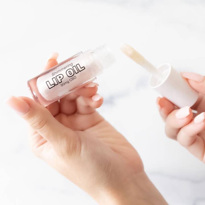 Moisturizing Lip Oil with CBD, Vitamin E - Shimmering Pearl for wholesale by Twine