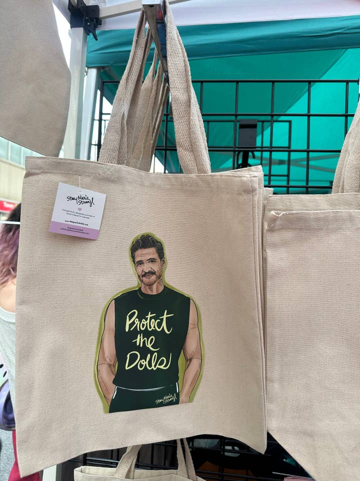 Protect the Dolls (Pedro Pascal) Tote for wholesale by Stacy Marie Stranzl
