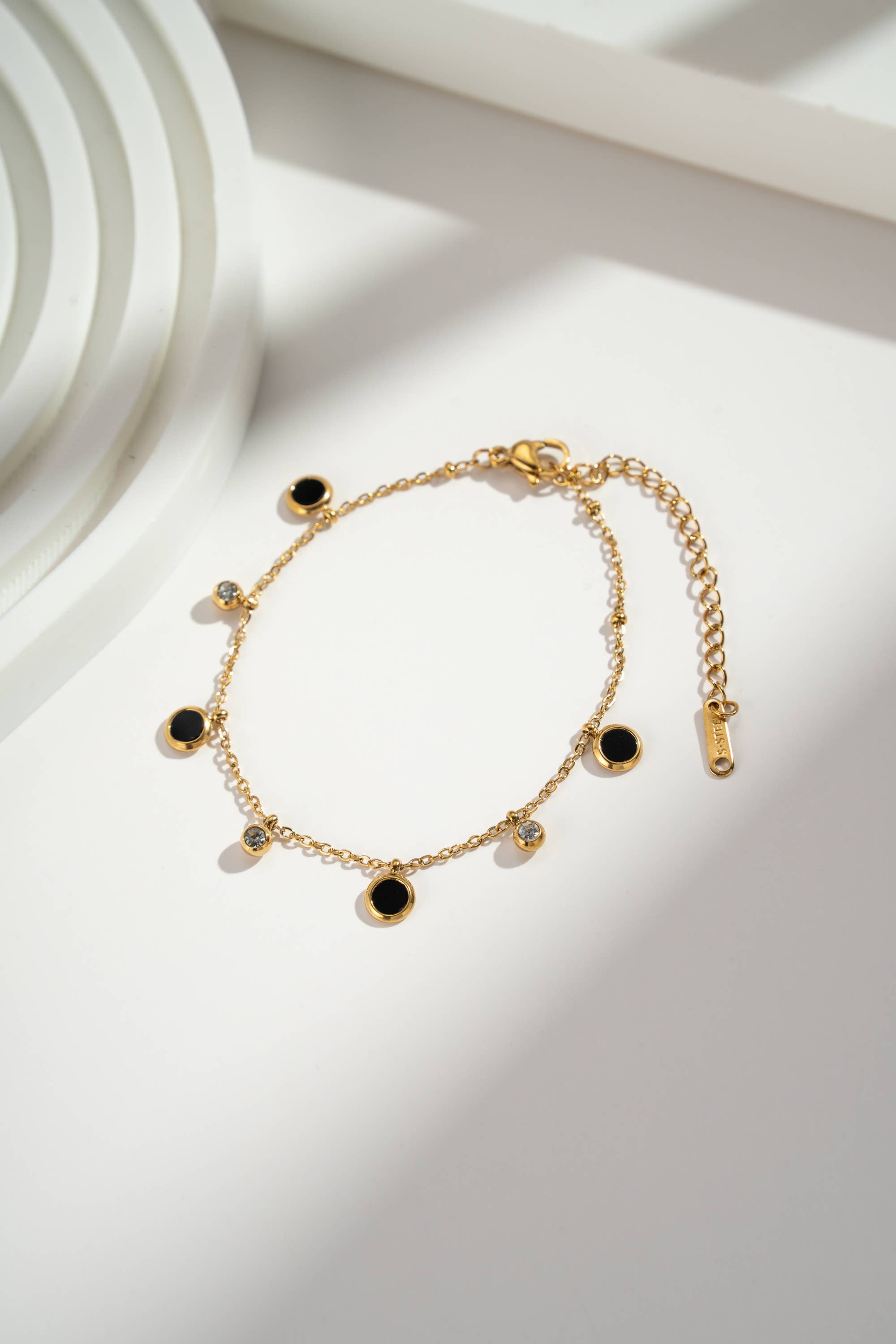 COSMOS – wholesale Charm/dangle bracelet – Black and gold charm bracelet in stainless steel1