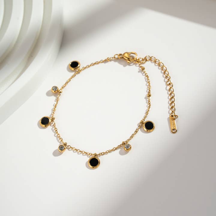 COSMOS – wholesale Charm/dangle bracelet – Black and gold charm bracelet in stainless steel1