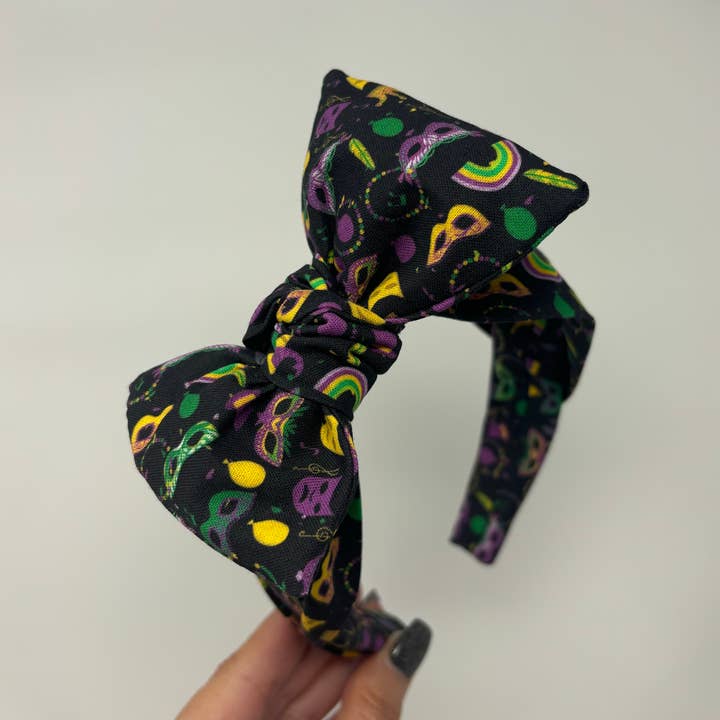 Let the Good Times Roll Mardi Gras Big Bow Headband for wholesale by Bella Notte & Co