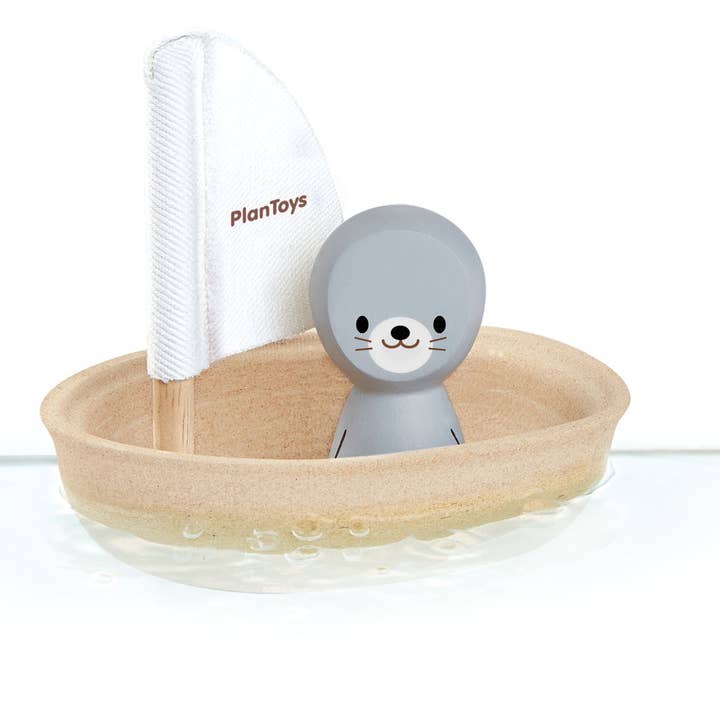 Sailing Boat Seal Wooden Bath Toy PlanToys for wholesale by Little Concepts Distribution Ltd
