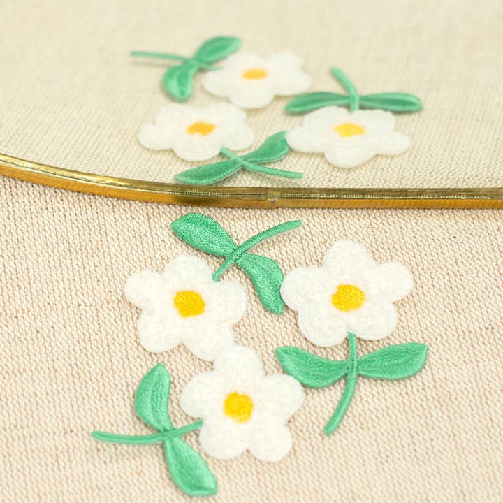 Left flower badge for wholesale by LA DROGUERIE