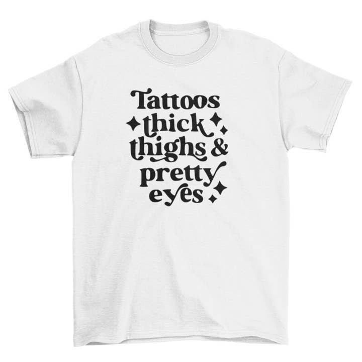 Wickedly Divine Shop – T-shirt estampada - Mulher por atacado – Camisa Grossa, Tatutoo Pretty Eyes, Tatutoo Lover3