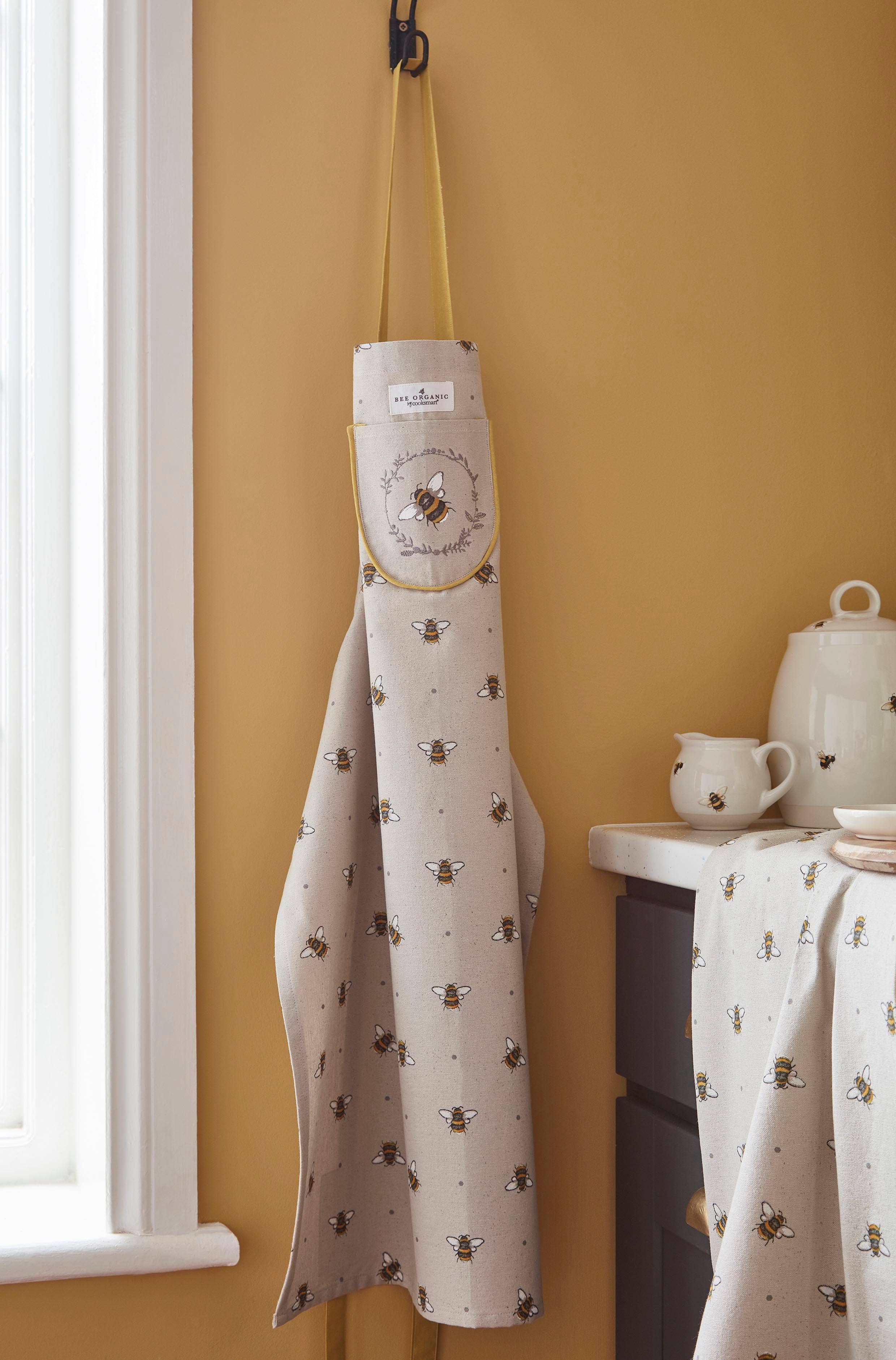 Natural Apron - Organic Cotton (GOTS) Bumble Bees by Cooksmart for wholesale on Faire1
