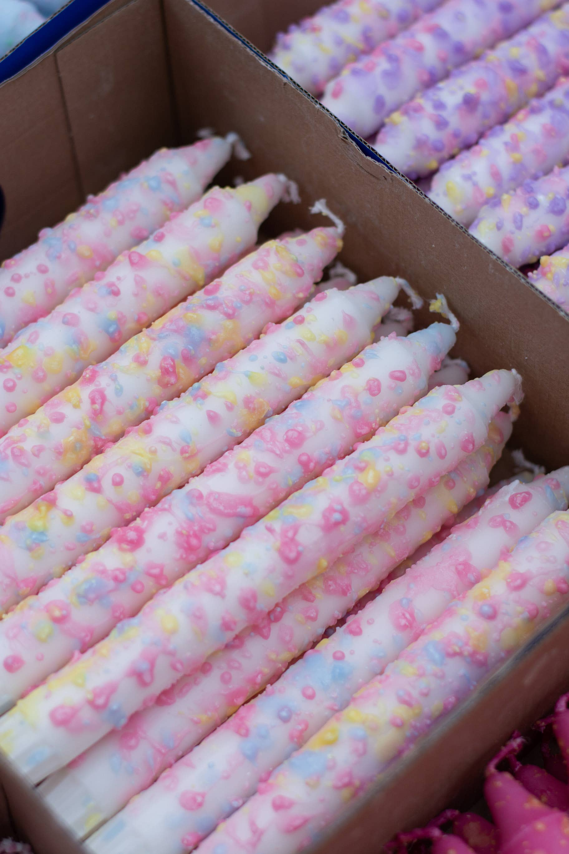 Wholesale Taper candles- rainbow confetti for your store - Faire