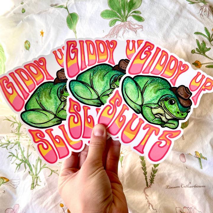 Hollandaize Art - Wholesale Sticker - "Giddy Up Sluts" Cowboy Frog Bumper Sticker