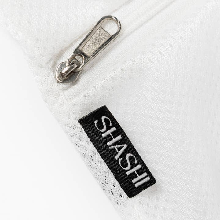 White SHASHI Laundry Bag for wholesale on Faire