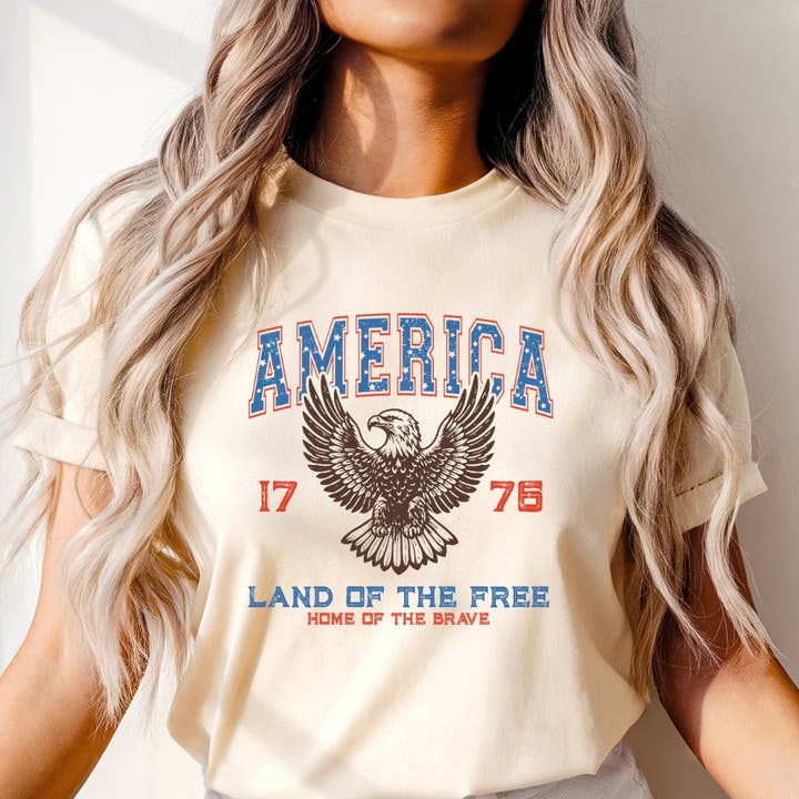 America Land Of The Free 1776 4th of July Graphic Tee for wholesale by Happy Mail Wholesale