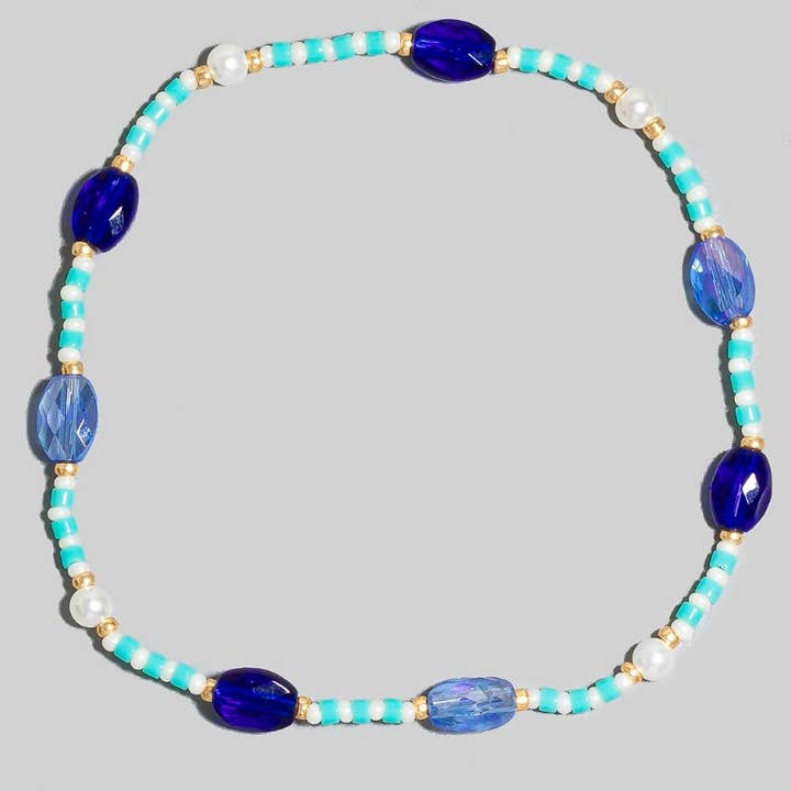 Ovalt facetslebet glasperle elastisk armbånd for engroshandel hos The Looks by Fame Accessories