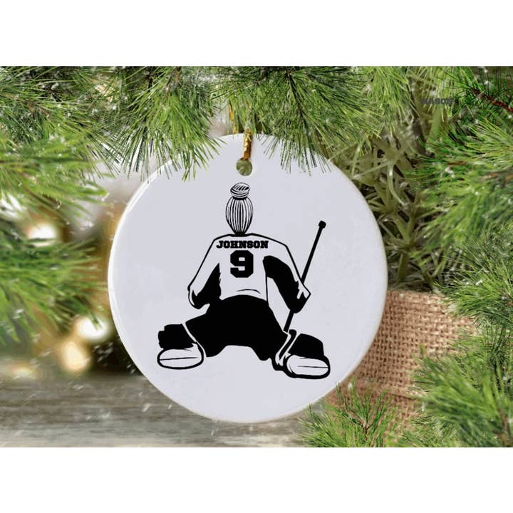 Female Goalie Hockey player ornament with bun for wholesale by Kelabels