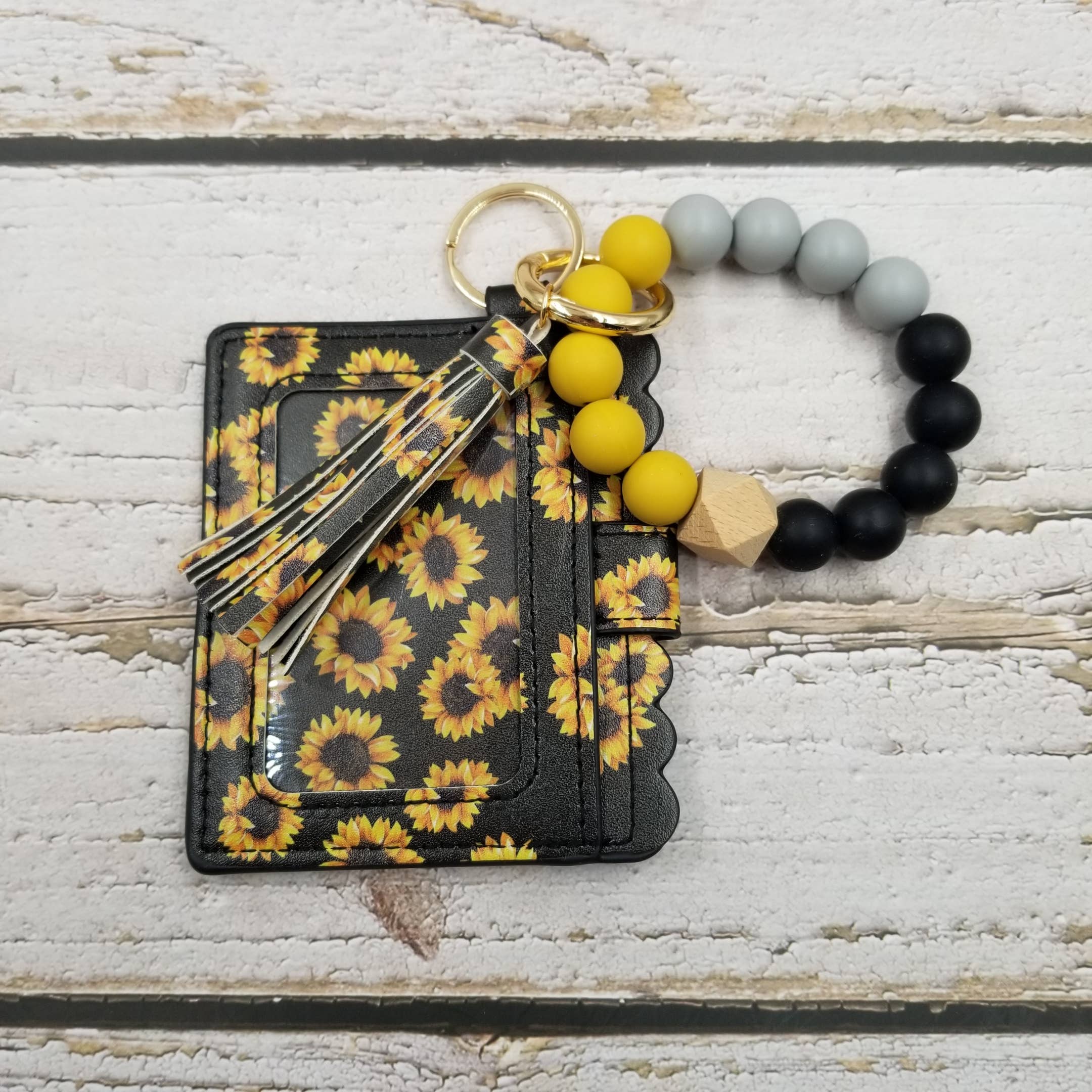 Treasure Wholesale - Vendita all'ingrosso Portafogli - Donna - Portachiavi a portafoglio con bracciale con fiore di sole1